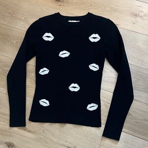 Lush Black Sweater with Cream Lip Pattern